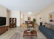 Thumbnail 4 of 16 - a living room and dining room with a couch and a table at Blue Hills Village, Canton, 02021