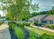 Thumbnail 13 of 23 - Exterior Landscaping With Walkway And Trees at The Birches of Esopus, Ulster Park, NY.