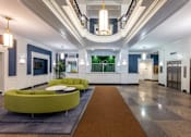 Thumbnail 12 of 14 - a lobby with blue and white walls and a green couch  at 140 Clarendon, Massachusetts, 02116