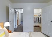 Thumbnail 5 of 9 - Bedroom with cozy bed and lamp at Birchwood Village Apartments, Kingston, New York