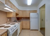 Thumbnail 1 of 23 - Kitchen Layout With Wood Cabinets And White Appliances at The Birches at Esopus, Ulster Park