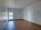 Thumbnail 3 of 21 - Unfurnished Living Area at Blake Estates, Hyde Park Massachusetts