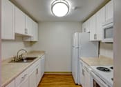 Thumbnail 2 of 14 - One bedroom apartment kitchen at Rockingham Glen in West Roxbury, MA