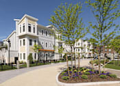 Thumbnail 6 of 12 - A row of houses with a small garden in front. at The Anne M. Lynch Homes at Old Colony, South Boston