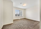 Thumbnail 16 of 17 - a bedroom with white walls and carpet at Creekwood Apartments, Watertown, NY