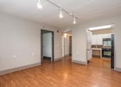 Thumbnail 6 of 19 - Open Floor Plan of One Bedroom Apartment with Hardwood Floors and Track Lighting. at Moorhead Tower Apartments, Pennsylvania