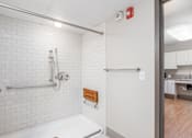 Thumbnail 10 of 19 - Updated Bathroom with Tile and Grab Bars. at Moorhead Tower Apartments, Pittsburgh, 15213