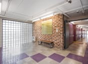 Thumbnail 16 of 19 - Updated Corridors with Seating and Art. at Moorhead Tower Apartments, Pittsburgh, PA, 15213