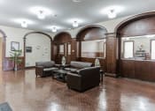 Thumbnail 11 of 12 - Community room with tables and chairs at 13 State Street, Schenectady NY