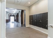 Thumbnail 12 of 12 - a view of the mail room at 13 State Street Apartments.