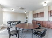 Thumbnail 10 of 12 - Community room with tables and chairs at 13 State Street, Schenectady NY