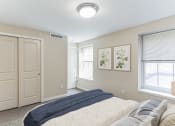 Thumbnail 1 of 12 - a bedroom with a closet and an open door at 13 State Street, Schenectady NY