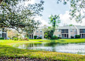 Thumbnail 1 of 14 - Pond view at Fishermans Landing Apartments in Ormond Beach, FL.