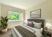Thumbnail 3 of 6 - Bedroom with Carpet and Large Window.