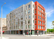 Thumbnail 9 of 14 - A modern multi-story building with a red and grey facade at Pok Oi Residences, Boston, MA, Massachusetts, 2111