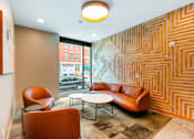 Thumbnail 10 of 14 - A room with a patterned wall and a couch at Pok Oi Residences, Boston, MA, Massachusetts, 2111