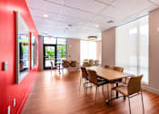 Thumbnail 11 of 14 - A conference room with a long table and chairs at Pok Oi Residences, Boston, MA, Massachusetts, 2111