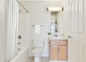 Thumbnail 4 of 17 - Bathroom With Vanity And Shower / Bathtub at Creekwood Apartments, Watertown, NY