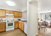 Thumbnail 2 of 17 - Open Kitchen Layout With View Into Living Room Area at Creekwood Apartments, New York