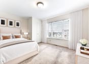 Thumbnail 3 of 15 - a bedroom with a large bed and a large window  at Summit Wood Apartments, Watertown, 13601