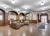 Thumbnail 6 of 12 - a view of the lobby with arches and couches at 13 State Street Apartments