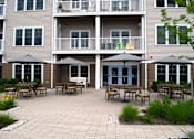 Thumbnail 15 of 15 - Outdoor Community Patio at Ocean Shores Apartments in Marshfield, MA
