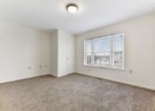 Thumbnail 13 of 15 - Bedroom Layout With Carpeted Flooring, Large Window  at Summit Wood Apartments, Watertown, 13601