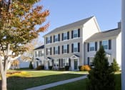 Thumbnail 4 of 9 - Exterior Of Building With Front Yard And Driveway.