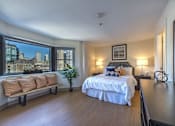 Thumbnail 3 of 6 - a bedroom with a bed and a large window  at Waterford Place, Massachusetts, 02118