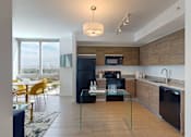 Thumbnail 12 of 36 - Modern kitchen at Douglas Enclave in Miami, Florida.