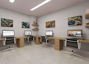 Thumbnail 17 of 17 - A modern office space with computers and artwork on the walls.