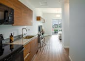 Thumbnail 18 of 36 - Studio kitchen at Douglas Enclave, Miami, FL.