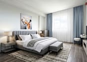 Thumbnail 1 of 15 - A modern bedroom with a large bed and a television.