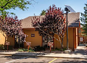 Thumbnail 3 of 42 - A yellow building with a sign that says "Landing Office" on it.