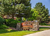 Thumbnail 1 of 42 - A sign that says "Bearcreek" is in front of a pine tree.