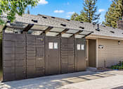 Thumbnail 10 of 18 - A row of dark brown garage doors with the word "LUXE" on the top.