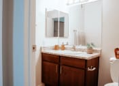 Thumbnail 25 of 26 - a bathroom with a sink and a toilet