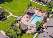 Thumbnail 14 of 34 - A backyard with a pool and a gazebo.