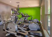Thumbnail 32 of 32 - A row of exercise bikes are lined up in a row.