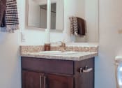 Thumbnail 11 of 26 - a bathroom with a sink and a toilet