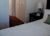 Thumbnail 9 of 26 - a bedroom with a bed and a ceiling fan