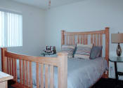 Thumbnail 8 of 26 - a bedroom with a bed and a window