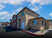Thumbnail 20 of 21 - new apartments in a row with a parking lot