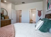 Thumbnail 25 of 32 - a bedroom with a white bedspread and a pink blanket