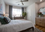Thumbnail 16 of 32 - a bedroom with a large bed and dresser