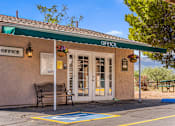 Thumbnail 17 of 22 - A small office entry with a green awning at Rio Verde Apartments.