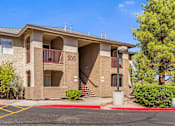 Thumbnail 5 of 16 - Apartment building number 500 with a parking lot in front.