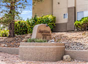 Thumbnail 3 of 16 - A sign that says Sagewood Apartments 370 is in front of a building.