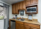 Thumbnail 18 of 31 - Efficient Appliances In Kitchen at Pine View Village Apartments, Arizona, 86001