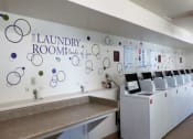 Thumbnail 21 of 31 - Laundry Room at Pine View Village Apartments, Flagstaff, 86001